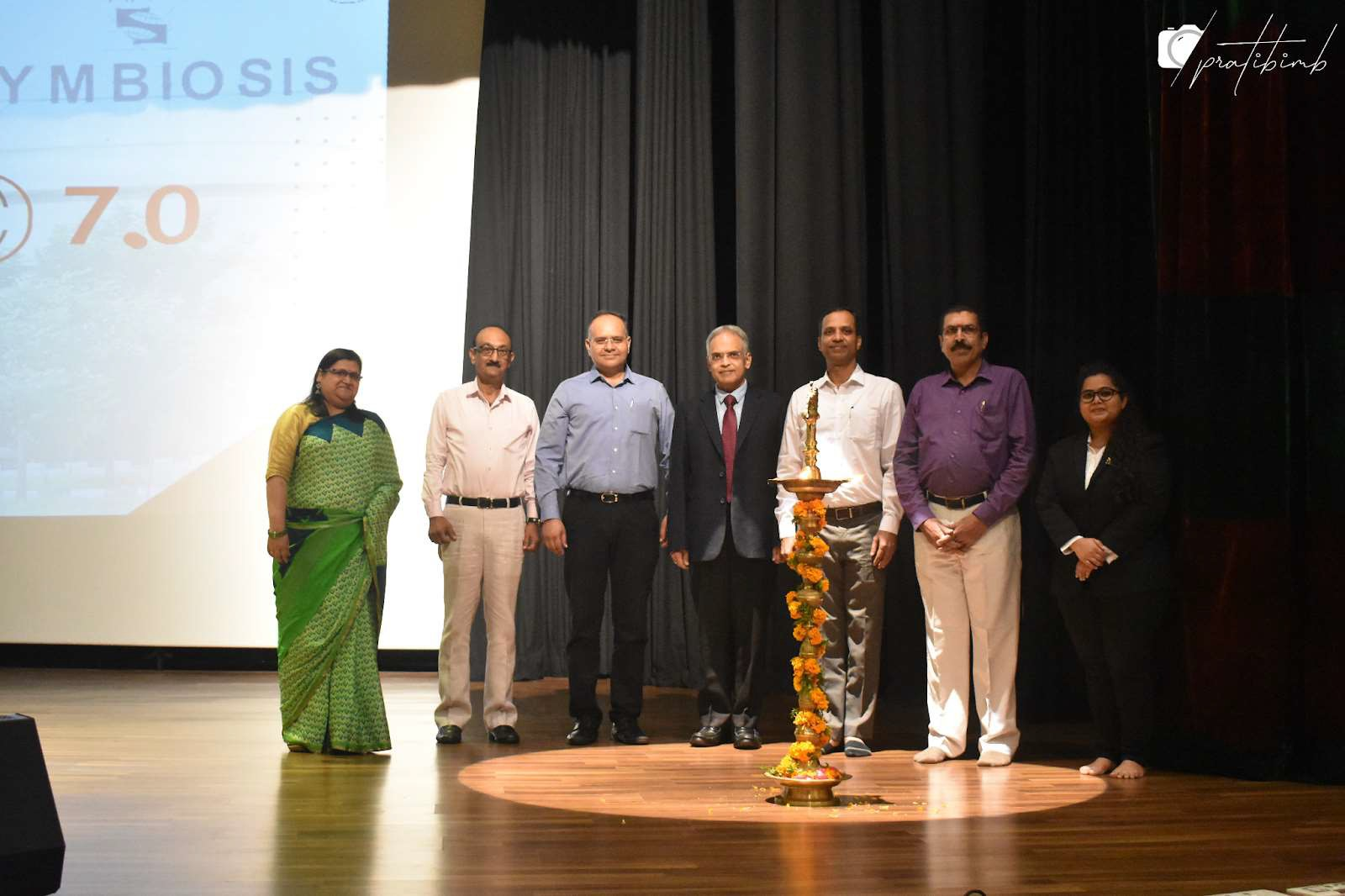 Ceremonial Lighting of the lamp by Dr. K.P. Venugopala Rao, Dr. Shyamsunder Chitta, Dr. Ridhi Rani and the distinguished dignitaries present for the event Mr. Ankur Chaturvedi, Associate Vice President - Business Excellence & Quality at Emami Ltd., Dr. Rajesh Parekh, Resilience Coach at Resilient Leadership, Mr. Tarun Srivastava, the chief manager at Polycab Support Force and Ms. Asmita Arjun Dalvi .
 