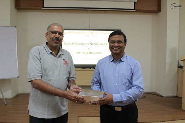 Dr. Shyam Sunder Chitta felicitating Mr. Raja Bhushan