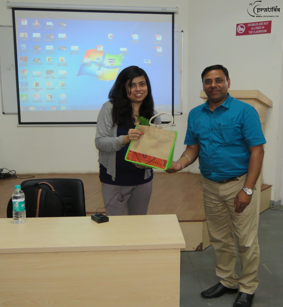 Dr. Tanmoy De felicitating Ms. Rimjhim Ray at SIBM