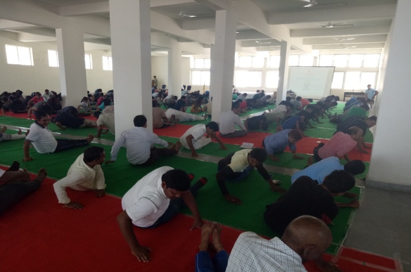 Students, Faculty, Staff preforming Yoga at SIBM